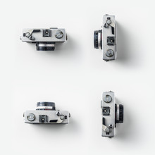 Top View Of Vintage Cameras On White Background Desk For Mockup, Collection Of Diverse Angle.