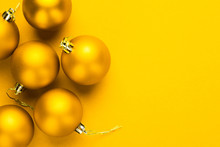 Christmas Tree Decoration Balls On Yellow Background With Copy Space