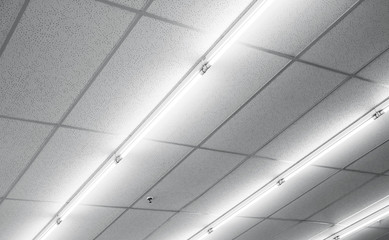 Warm white fluorescent or neon light on ceiling