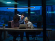 © .shock - Multiethnic startup business team in night office