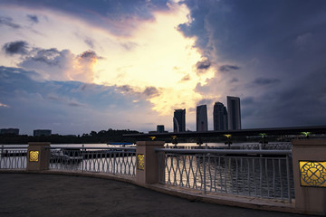 Wall Mural - Beautiful view of Putrajaya Lake located in Malaysia over stunning sunrise background and cloudy sky