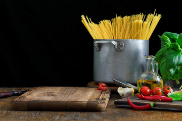 Canvas Print - kitchen board with set of ingredients for cooking Italian pasta