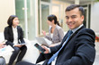 © leungchopan - Business people discuss in a meeting