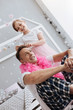 © Viacheslav Yakobchuk - Attentive fun child fixing dads crown