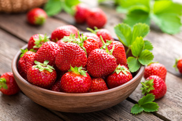 Wall Mural - Fresh juicy strawberries with leaves. Strawberry.