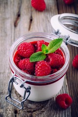 Wall Mural - Dessert with cream cheese, raspberry sauce, fresh berries and mint