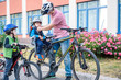 © pahis - Family cycling, father with happy kid riding bike outdoors