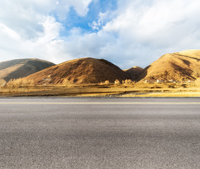 Wall Mural - empty asphalt road in tibetan area