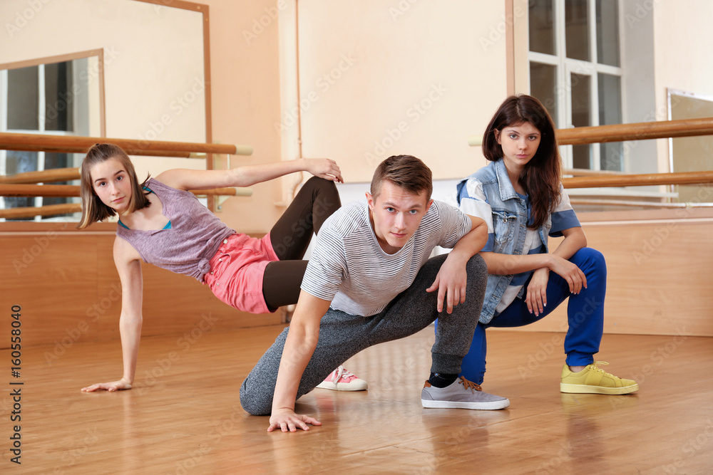 Group of young hip-hop dancers in studio