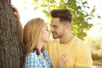 Poster - Happy young couple in park on spring day