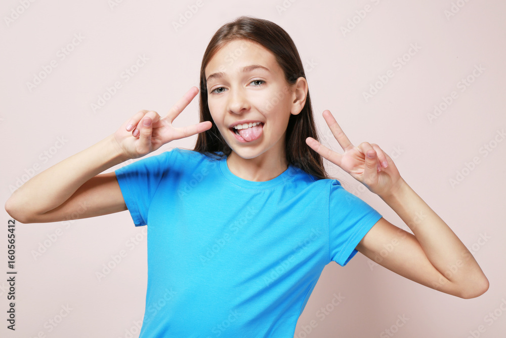 Cute funny girl on color background