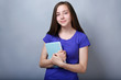 © Africa Studio - Cute pretty girl with book on color background