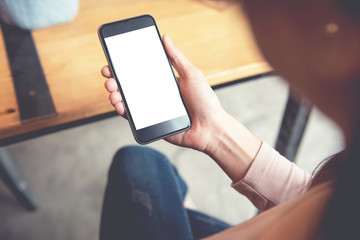 Close up of women hand holding smart phone with blank copy space white screen for create content.