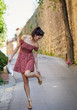 © ZoomTeam - Fashionably dressed woman on the streets of a small Italian town