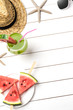Summer background with watermelon slices, straw hat and sunglasses