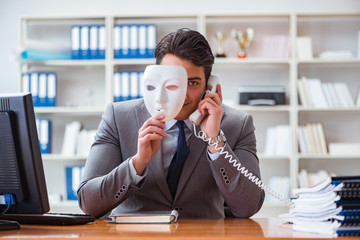 Wall Mural - Businessman with mask in office hypocrisy concept