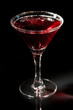 © Kondor83 - Martini glass with red cocktail of vodka, soda and grape juice