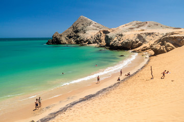 CABO DE LA VELA, COLOMBIA - AUGUST 24, 2015: Coast of La Guajira peninsula in Colombia. Beach Playa del Pilon. Pilon de Azucar hill in the background.