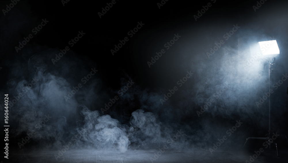 Conceptual image of a dark interior full of swirling smoke - obrazy, fototapety, plakaty 