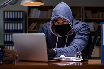 hacker stealing personal data from home computer