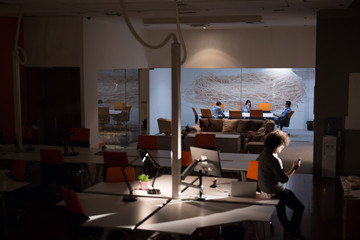 man working on computer in dark office