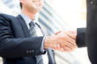 © Atstock Productions - Businessman making handshake with a businesswoman