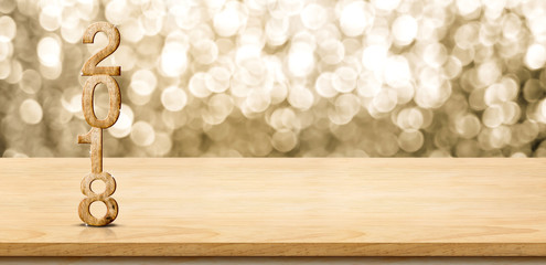 Poster - 2018 new year wood number on wood table with sparkling gold bokeh wall,panoramic banner for display or montage of product