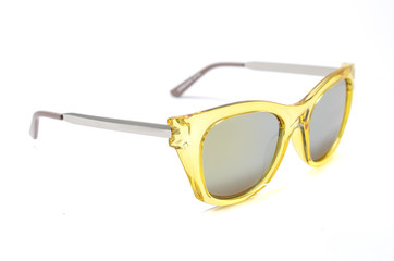 Wall Mural - Sunglasses in a transparent yellow frame isolated on white