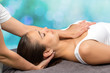 © karelnoppe - Woman receiving physio therapy on neck and chest.