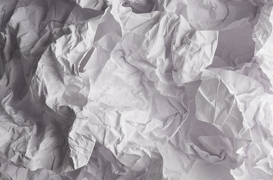 Wall mural - Crumpled wrinkled wavy grey paper texture, abstract polygon background. - crumpled