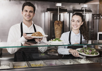 Portrait of happy workers with kebab