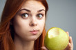 © SHOTPRIME STUDIO - Diet, vitamins A, B, C woman eating an apple, a woman took a bite of an apple and acer portrait background