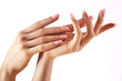 Beautiful woman's hands on light background. Care about hand. Tender palm. Natural manicure, clean skin. Pink nails