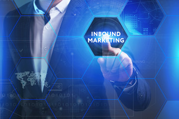 Business, Technology, Internet and network concept. Young businessman working on a virtual screen of the future and sees the inscription: Inbound marketing