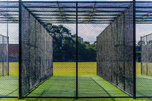 A Cricket Pratice Net On Green Grass In Melbourne, Victoria, Australia