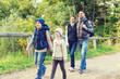 © Syda Productions - happy family with backpacks hiking in woods
