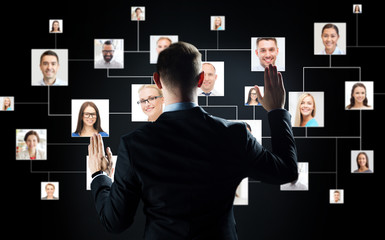 Wall Mural - businessman with virtual contact icons