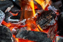 Fire Showing Piled Logs Burning In A Fire Place