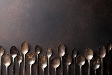 Poster - Old vintage spoons on stone table