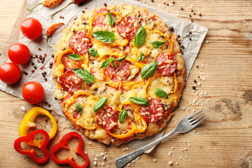 Wall Mural - Composition of tasty pizza, vegetables and spices on wooden table