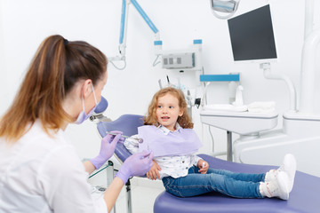 Wall Mural - Smiling little patient at dentist