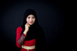 © NT_studio - Portrait of beautiful muslim asian woman over black background with happy muslim woman, Age 20-30 years.
