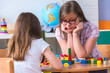 © lordn - Woman teacher concerned about preschool child