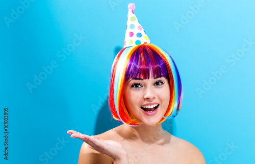 Party theme with a woman in a colorful wig