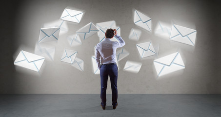 Poster - Businessman using email interface on a wall 3D rendering