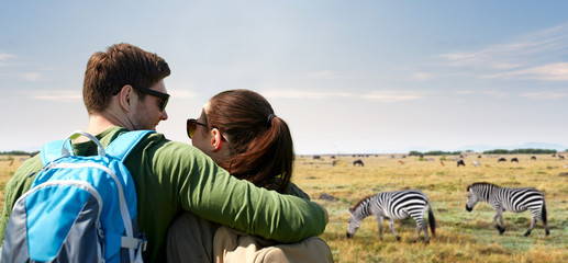 Canvas Print - happy couple with backpacks traveling