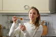 © Елена Кравчук - Young woman with honey food on kitchen