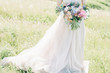 © producer - fine art wedding photography. Beautiful bride with bouquet and dress with train in nature