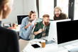 © Drobot Dean - Smiling colleagues in office talking