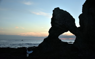 Sunrise at Australia rock in Narooma. The shape of Australia cut into the rock wall was accidental and was created when a ship was tied to the rock with large chains to prevent it from washing away.